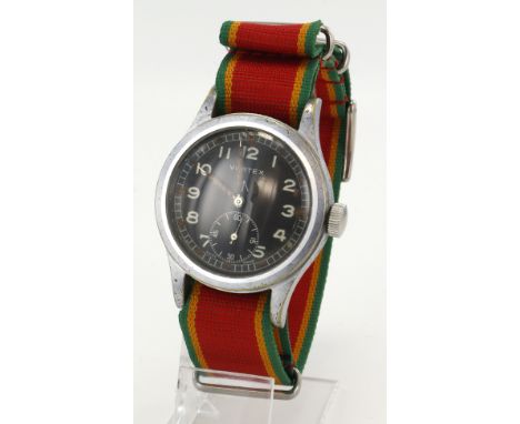 Vertex British military issue 'Dirty Dozen' wristwatch. The black dial with white Arabic numerals, broad arrow below 12, whit