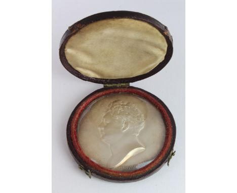 White metal or possibly silver uniface plaque 47mm depicting portrait of King George IV (1820-1830) signed Bain, behind glass