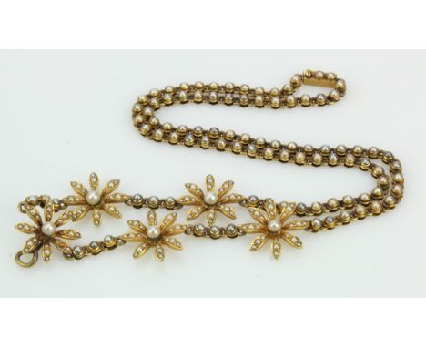 Yellow gold (tests 18ct) antique daisy necklace, five daisys set within the chain set with seed pearls and cultured pearls, f