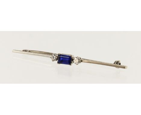 Platinum (tests 900 ) Art Deco diamond and sapphire bar brooch, step cut sapphire measures 6.5mm x 4mm, flanked with one roun