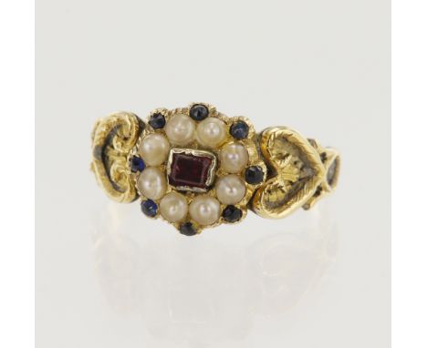 Yellow gold (tests 15ct) early Victorian mourning ring, flower head setting of one central step cut ruby measuring 3mm x 2.5m