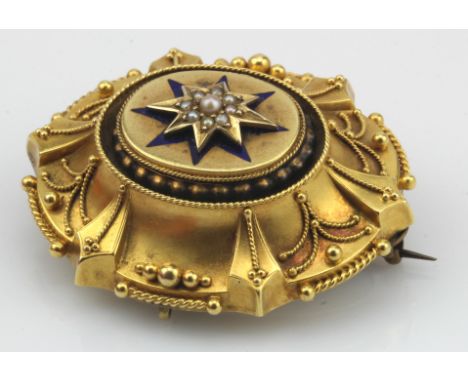 Yellow gold (tests high carat) Victorian Etruscan Revival brooch, seed pearl set star motif with royal blue enamelled star, b