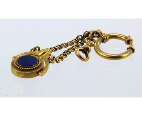 Yellow gold (tests 15ct) antique swivel fob, set with lapis lazuli, suspended from a fancy linked chain, bolt ring and dog cl