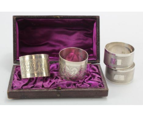 Pair of boxed Victorian silver napkin rings hallmarked RMEH Sheffield 1882 (tiny split to one ring) plus two modern engine-tu