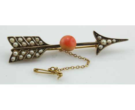 Yellow gold (tests 9ct) Victorian coral and pearl arrow brooch, one round cabochon coral approx. 9.5mm, set with twenty-one s