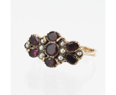 Yellow gold (tests 9ct) antique garnet and pearl dress ring, seven rhodolite garnets and eight seed pearls, head measures 11.