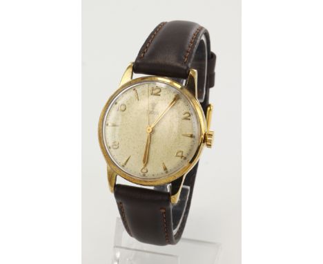 Gents 9ct cased Tudor manual wind wristwatch, hallmarked 1957. The cream dial with alternating gilt Arabic numerals and arrow