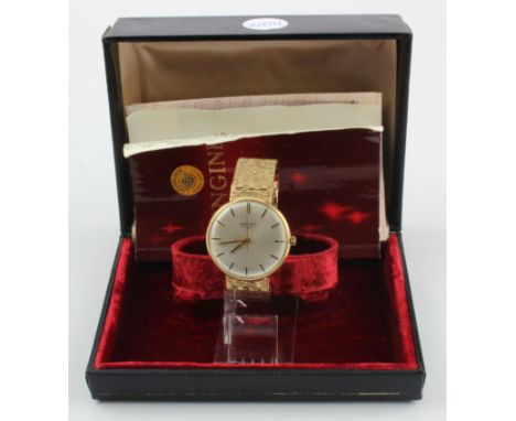 Gent 9ct cased Longines manual wind wristwatch, hallmarked London 1977. On an 9ct integral bracelet. Watch working when catal