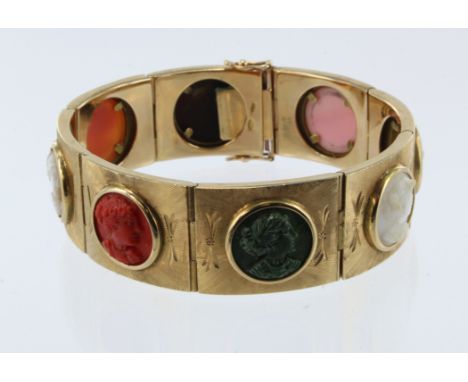 Yellow gold (tests 14ct) carved cameo linked cuff bracelet, eight carvings each depicting a lady in profile, stones include s