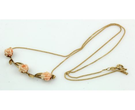 9ct yellow gold carved coral necklace, three carved angel skin coral flowers set on a foliate pendant, integral fine curb cha