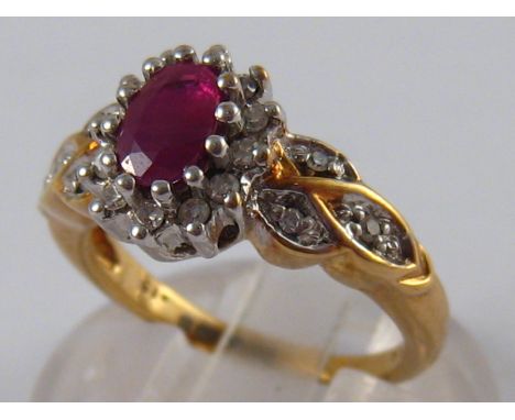 A 9 carat gold ruby and diamond ring, size J, 3.8 gms.