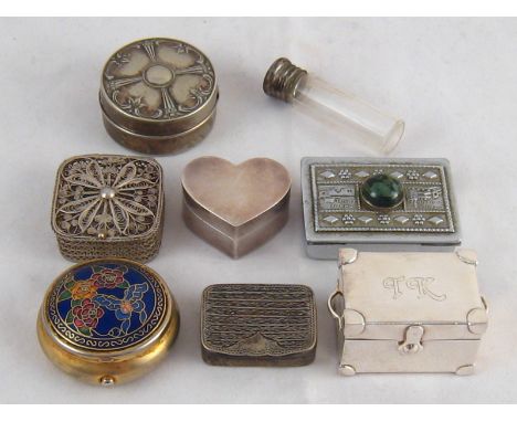 A mixed lot of seven small white metal boxes, including one filigree, one enamelled powder box, one a miniature trunk, one wi