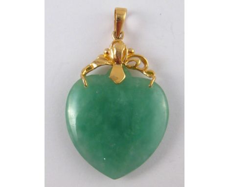 A jade heart pendant with yellow metal (tests 14 carat gold) fitting, approx 3.5cm drop.
