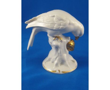 Dresden. A porcelain model of a crossbill with a fircone, blue crowned N and” Dresden” marks to underside. Ht.11cm. 