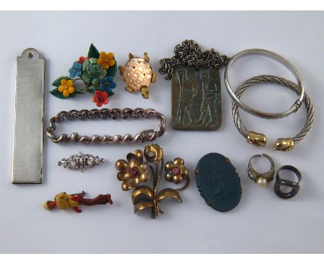 A mixed lot including bracelets, brooches, rings and a silver comb case, wt.33gm.  