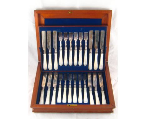 A fitted case of twelve pairs of Victorian silver fruit knives and forks with m.o.p. handles. Wilkinson & Co., Sheffield, 186