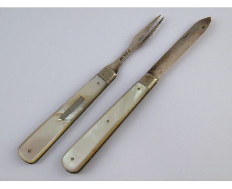 A silver bladed m.o.p. fruit knife and fork set, the two implements slotting together when not in use. Sheffield, 1929. 