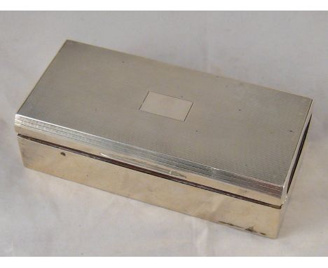 A silver cigarette case with engine turned finish. 18x9x5cm. high. London 1945. wt.454gm. 