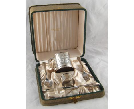 An American child's silver christening set, comprising knife, fork, spoon, napkin ring and mug, all engraved with nursery and