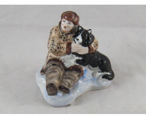 A Russian ceramic group of the explorer Ivan Papanin and his dog "Happy". Green Lomonosov and Jubilee marks to base. Ht 10cm.