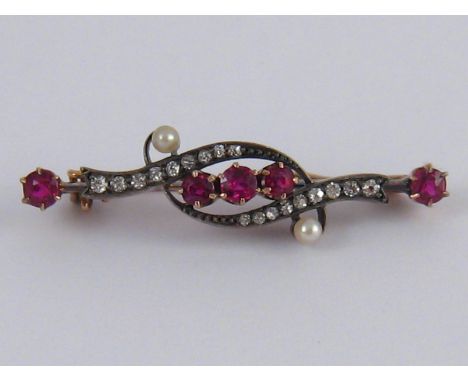 A boxed antique ruby, diamond and seed pearl brooch, approx 4.5cm long, 4.8 gms.
