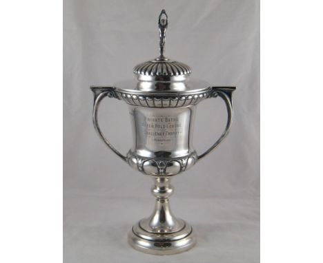 A large silver two handled lidded trophy cup, the finial a standing swimmer, Birmingham, 1929. Ht.40cm. wt. 1,009gm. 