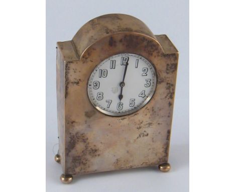 A silver cased mantel clock, the plain case with arched top on ball feet. Birmingham 1921. 9.5x4x 14cm. high. 