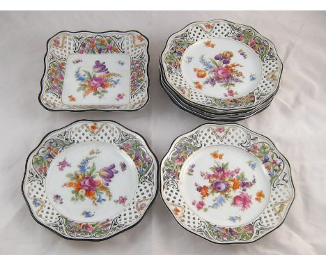 A set of six Dresden porcelain plates with painted floral centres and pierced rims, 21cm. diameter, and a square dish en suit