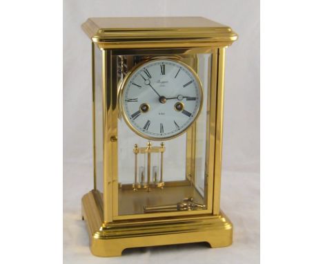 A four glass gilded brass eight day mantel clock  with mercury compensated pendulum striking on two bells  by Rapport, London