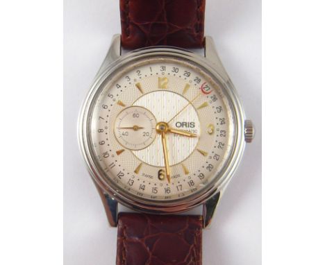A gent's Oris automatic watch in steel case with subsidiary seconds dial and sweep date hand. 