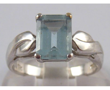 A white metal (tests 18 carat gold) aquamarine ring, the aquamarine measuring approx 8 x 6mm, ring size K, 4 gms.
