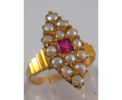 A yellow metal (tests 18 carat gold) marquise shape ruby and seed pearl ring, approx 22mm long, ring size L, 3.6 gms.
