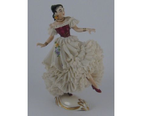 Dresden. A porcelain model of a Spanish dancer with voluminous skirts. Ht. 14.5cm., underglaze blue mark and "Dresden Dec. Ge