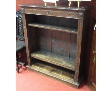 A Victorian carved oak book shelf, 120 x 105cm  