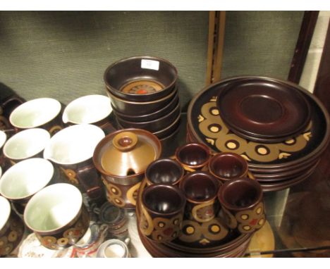 A Denby 'Arabesque' dinner service  Approximately:  6 dinner plates 7 pudding 2 casserole 1 meat plate 2 gravy boats 7 teapla