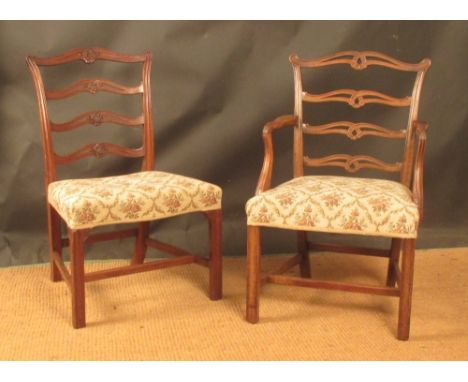 A set of four18th century mahogany ladder backed dining chairs, two carvers and two upright, (4)  