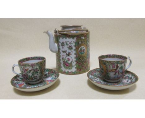 A Cantonese enamel teapot together with two tea cups and saucers (5)  