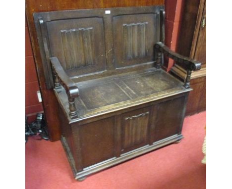 An oak monk's bench with linenfold panels, 93cm wide  
