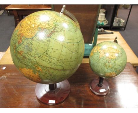 A modern terrestrial globe together with another smaller (2)  