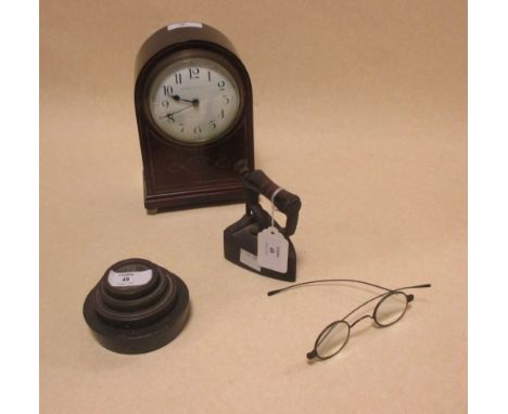 A mahogany cased mantel clock with key, spectacles, small iron and weights (4)  