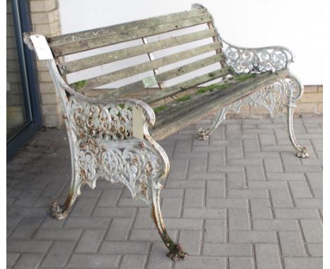 A white painted cast iron bench  