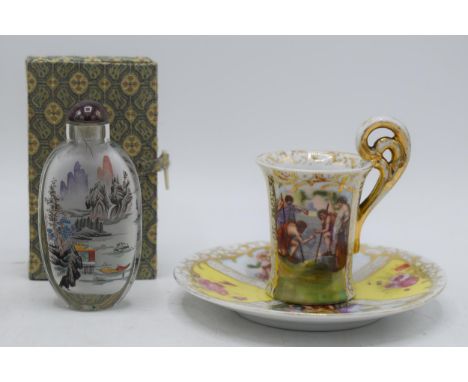 A pair of continental cups and saucers with gilt decoration with Roman scenes together with a 20th century cased Chinese scen