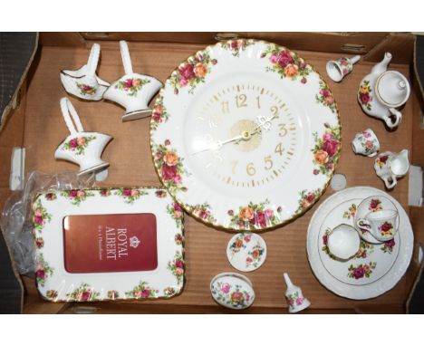 Royal Albert Old Country Roses and similar pottery to include a wall clock, posie baskets and others  Condition is generally 