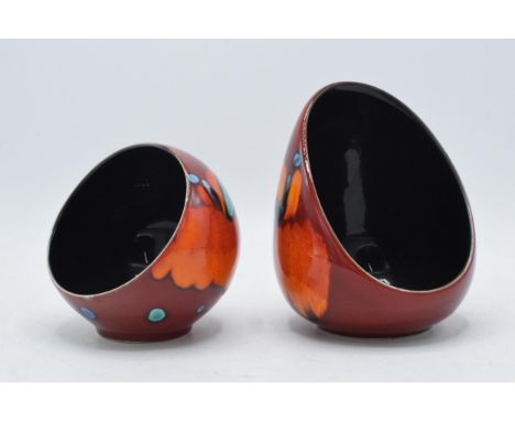 A pair of Poole Pottery concave tea light holders (2), tallest 13cm tall.  In good condition with no obvious damage or restor