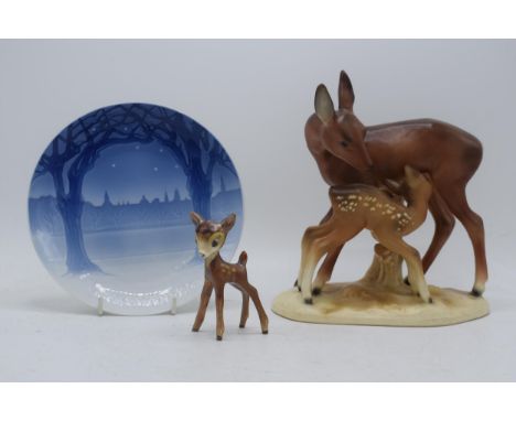 A Cortendorf figure of a deer and fawn, a Goebel stylised figure of Bambi and a Bing and Grondahl '1904' Christmas plate (3).