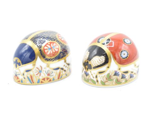 Royal Crown Derby paperweights Red Ladybird with 7 spots and a Blue ladybird, both first quality without stoppers (2).  In go