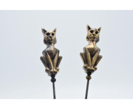 Pair of vintage brass and steel cat hatpins, 22cm long  