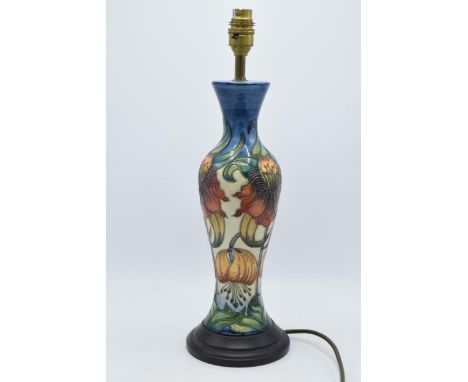 Moorcroft lamp base in the Anna Lily design, 34cm tall exc. fitting.  In good condition with no obvious damage or restoration