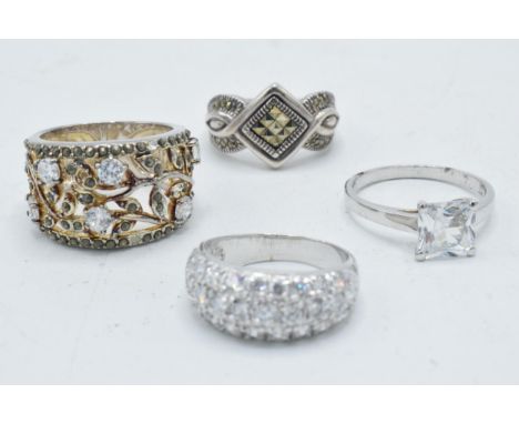 A collection of 4 silver rings of varying designs (4).  