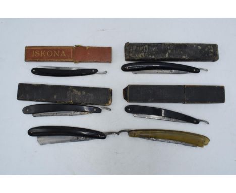 A collection of vintage cut throat razors, some with boxes, to include Solingen, Crown &amp; Sword, Iskona and an early milit